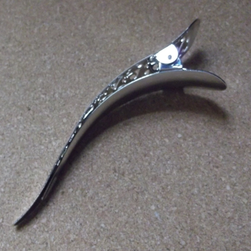 Curved metal beak 