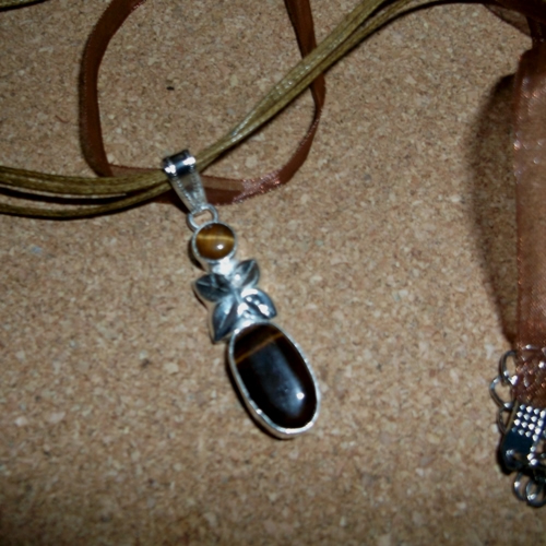 Tigers Eye in silver mounting on a necklace - supplied by Longhaired Jewels