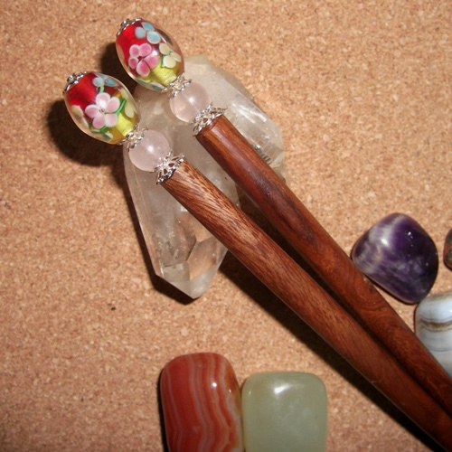 Teak hairsticks topped with lovely floral style beads handmade by Longhaired Jewels